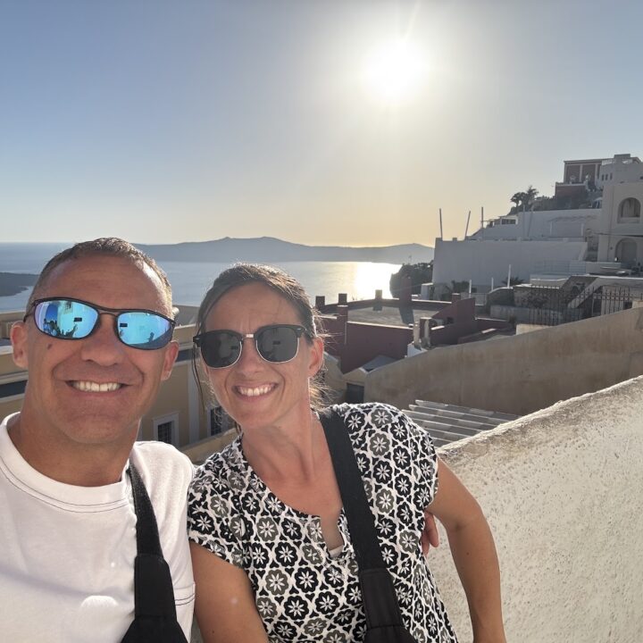 Paul and corene Hutchings taking a selfie at sunset in Santorini.